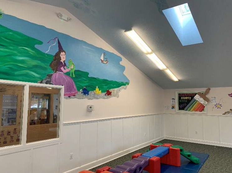 Bright, cheerful daycare environment with age-appropriate spaces for children of all stages, from infants to preschoolers.