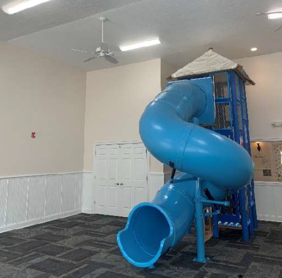 Playground area outside Young Explorers school, designed with age-appropriate play equipment for children.