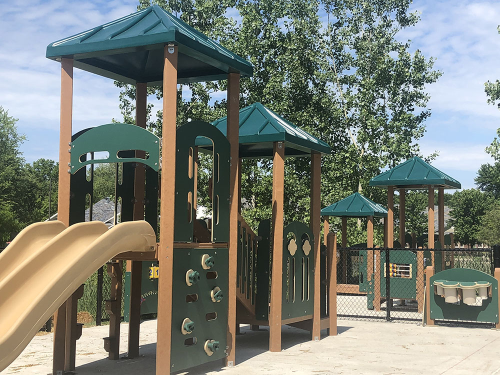 Playground area outside Young Explorers school, designed with age-appropriate play equipment for children.